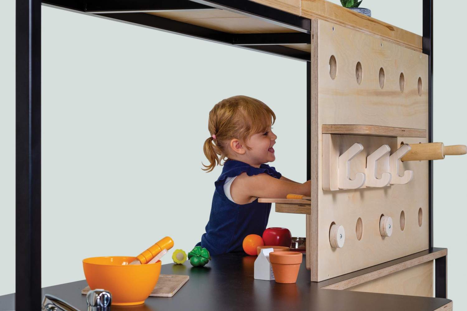 wood and steel roll play Hub with open shelving for Pre-schools